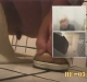 A multi-cam voyeur scene with a caucasian woman pooping into a floor toilet. This is most likely Eastern European.